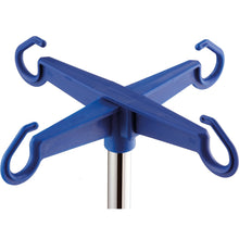 Close-up of a Novocal bottle cross for infusion stands (plastic, blue, 4 safety bottle hooks, 1 piece) as an accessory for hospitals, securely attached to a stable metal infusion stand.