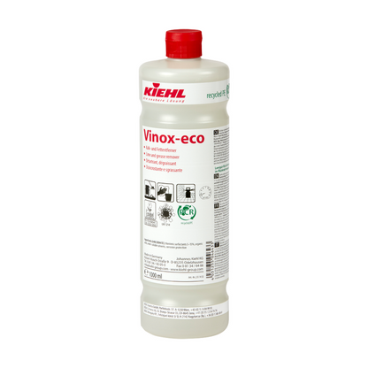 White plastic bottle of the Kiehl Vinox-eco lime and grease remover from Johannes Kiehl KG with a red cap. The front label contains product information, application instructions, and pictograms.