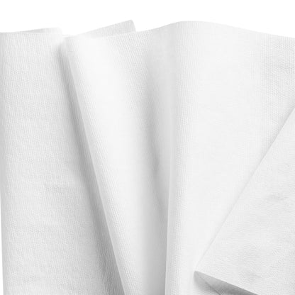 Several folded white paper towels from the WypAll® X50 General Clean large roll (1 roll x 1100 sheets) from Kimberly-Clark GmbH are presented overlapping, showing their texture on a plain white background - ideal for versatile cleaning tasks.
