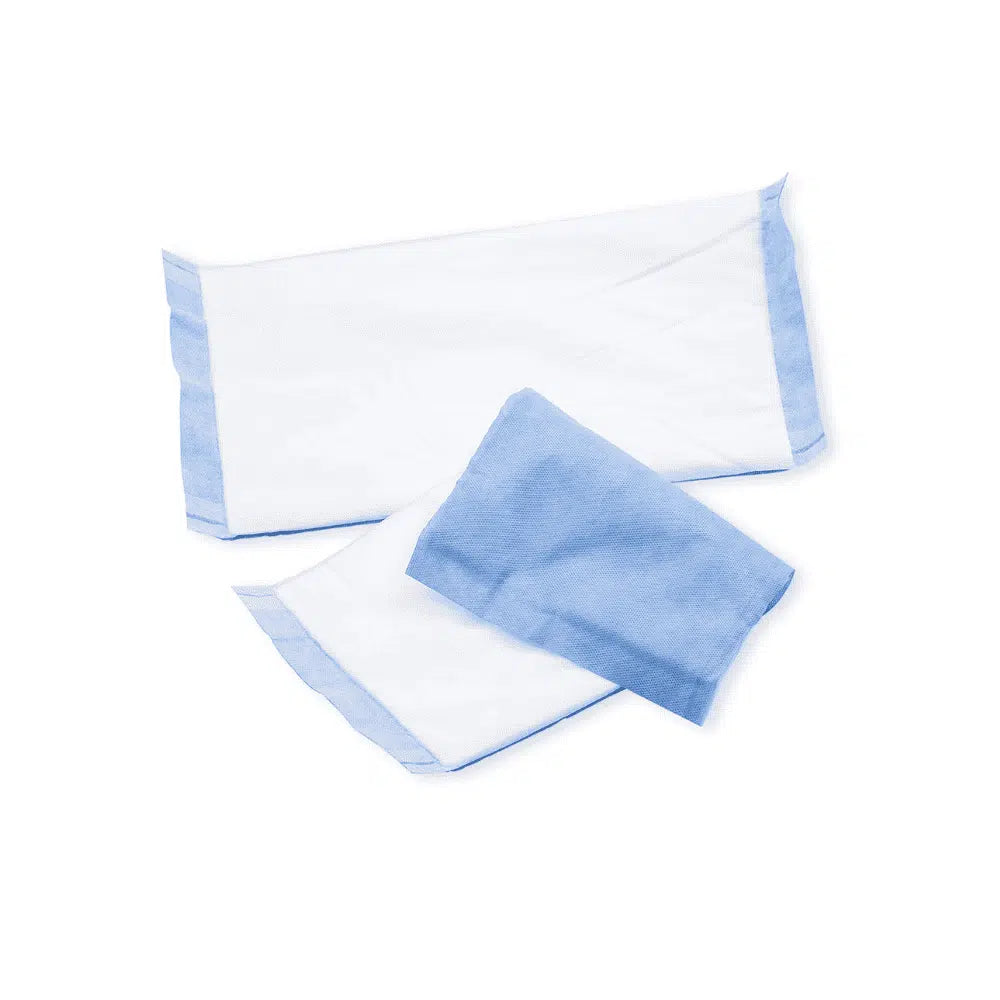 Two folded white towels and a small blue washcloth BeeSana® suction compress from Meditrade GmbH, neatly arranged on a plain white background.