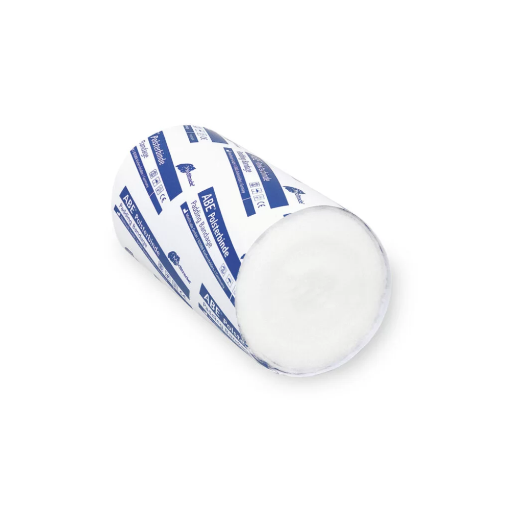 A roll of traditional white goat cheese, wrapped in a blue and white padding bandage with the brand name Meditrade ABE®, isolated on a white background. The exposed end of the cheese shows its creamy texture.