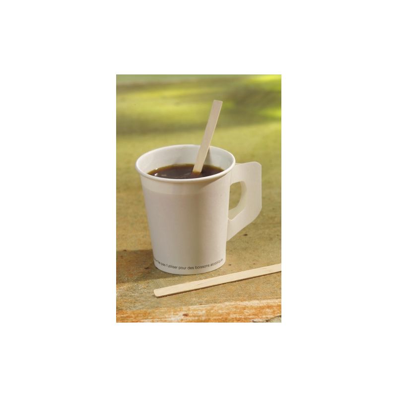 A white paper cup filled with coffee stands on a wooden surface. Inside is a PAPSTAR "pure" stirring stick from PAPSTAR GmbH and another next to it. Sunlight casts gentle shadows around the cup, highlighting its cheerful simplicity.