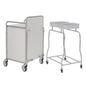 A Novocal station wagon made of stainless steel with all-around welded pipe connections stands next to a double hamper stand with two lid openings, both for use in medical facilities, against a white background.