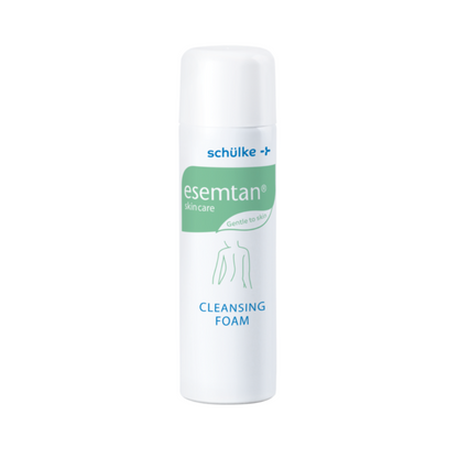 A white 500 ml bottle of Esemtan® cleansing foam from Schülke & Mayr GmbH has a green-blue label on the front with product information and the simple outline of a human body.