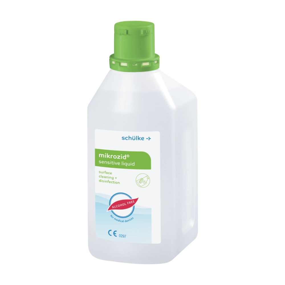 A white plastic bottle with a green cap and the label "Schülke mikrozid® sensitive liquid". The label indicates that it is an alcohol-free surface cleaning and disinfectant for alcohol-sensitive products from Schülke & Mayr GmbH.