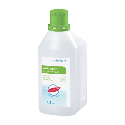 A white plastic bottle with a green cap and the label "Schülke mikrozid® sensitive liquid". The label indicates that it is an alcohol-free surface cleaning and disinfectant for alcohol-sensitive products from Schülke & Mayr GmbH.