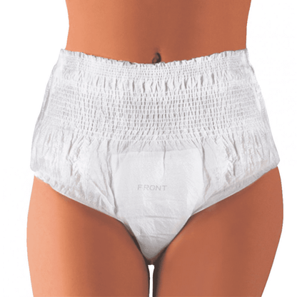 A person wears white Seni Active Plus incontinence pants from TZMO Deutschland GmbH, depicted from waist to thighs against a solid background. The word “FRONT” is printed on the pants, designed for comfort and support in case of bladder weakness.