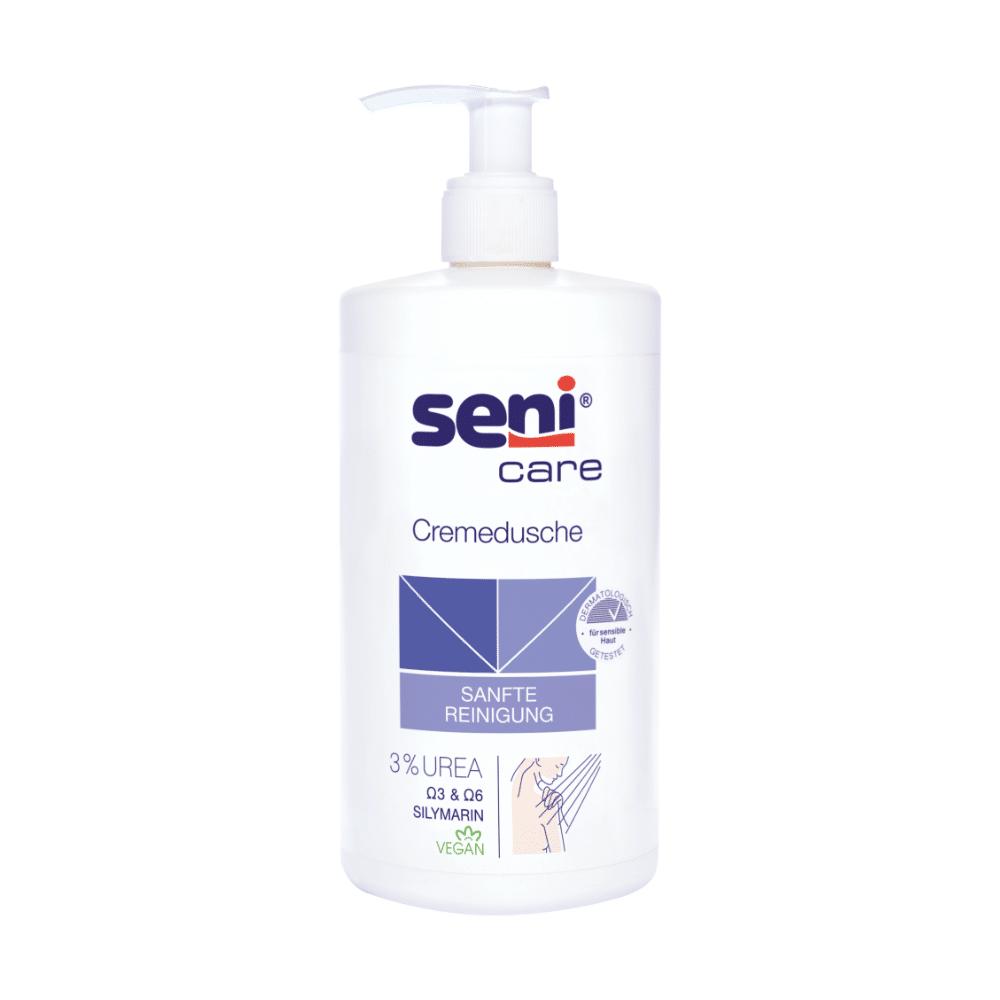 Die Seni Care Cremedusche von TZMO Deutschland GmbH, 500 ml, enthält 3% Urea, Silymarin und eine vegane Formel. Die weiße Flasche hat einen Pumpspender und trägt die blaue Grafik „SANFTE REINIGUNG“, ideal für trockene Haut.