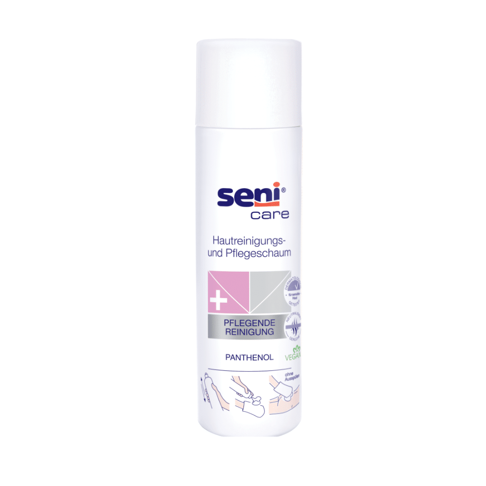Pictured is a white, cylindrical 500 ml bottle of Seni Care skin cleansing and care foam from TZMO Deutschland GmbH. The German label with application illustrations highlights panthenol and vegan-friendly ingredients for sensitive skin. It features a white cap.