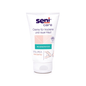 A 100 ml tube of Seni Care Cream from TZMO Deutschland GmbH for dry and rough skin has a white background with light pink and green accents. The label indicates 10% urea, is fragrance-free, increases moisture content, and includes a German instruction.