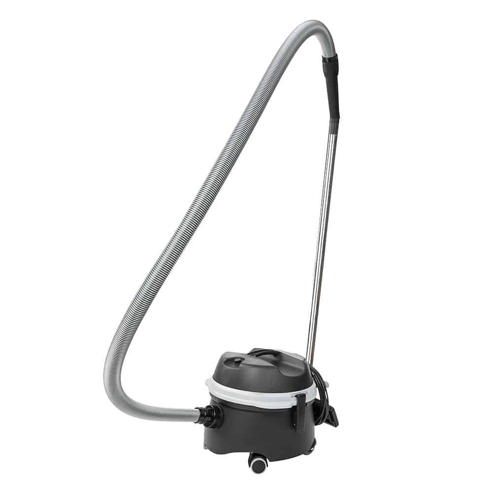The TASKI go from Diversey Deutschland GmbH & Co. OHG is a streamlined vacuum cleaner with a simple and functional design in black and gray. It includes important components such as a suction hose, a metal rod, and a dust nozzle for efficient cleaning. Its wheels allow for easy maneuverability while ensuring powerful yet quiet operation.