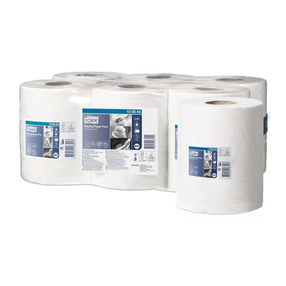 Six rolls of Tork 130044 Strong Multipurpose Paper Towels Premium M2 are displayed, one roll prominently in the foreground and five in the background. Each roll is labeled with product information from TORK – Essity Professional Hygiene Germany GmbH. The white paper with QuickDry quality seems to be packaged for commercial premium use.