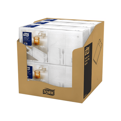 A carton with six packs of Tork 13662 Tork Soft Guten Appetit Cutlery Bag Napkins, each with a blue label. The packaging is adorned with an illustration of a knife, fork, and glass along with the phrase "Guten Appetit" and embodies elegance in dining with every Tork Soft product from Essity Professional Hygiene Germany GmbH.