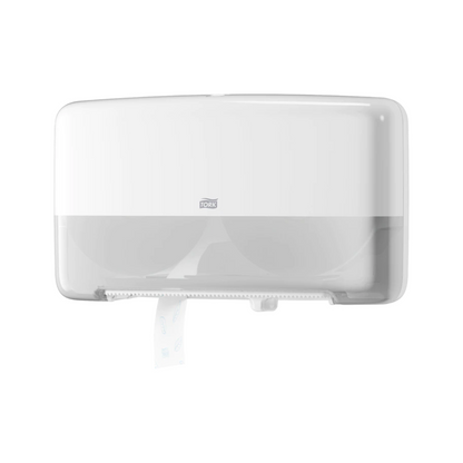 The Tork 555500 Twin Roll Dispenser for Mini Jumbo Toilet Paper T2 from Essity Professional Hygiene Germany GmbH is a stylish and functional white wall-mounted dispenser with a transparent bottom for two rolls. A small portion of toilet paper hangs down from the front, adding both elegance and functionality.