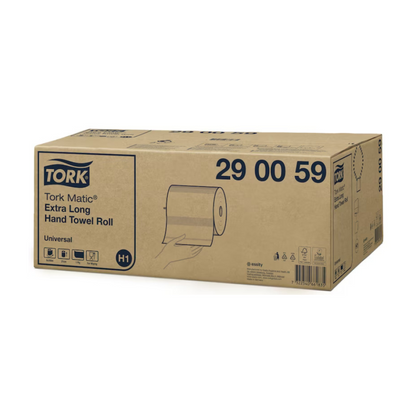 On a box labeled "Tork Matic® 290059 extra-long roll towel Universal H1 1-ply," a hand is depicted holding an extra-long towel roll. The box, manufactured by TORK – Essity Professional Hygiene Germany GmbH, contains various shipping and handling symbols and includes six rolls.
