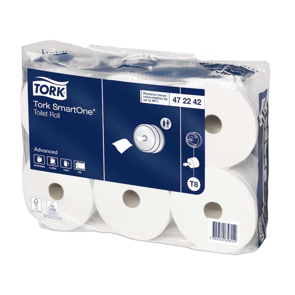 A carton of Tork SmartOne® toilet paper, designed for hygienic single sheet dispensing, is delivered in a transparent package revealing the six white rolls. The label shows product details in an elegant blue and white design by TORK – Essity Professional Hygiene Germany GmbH.