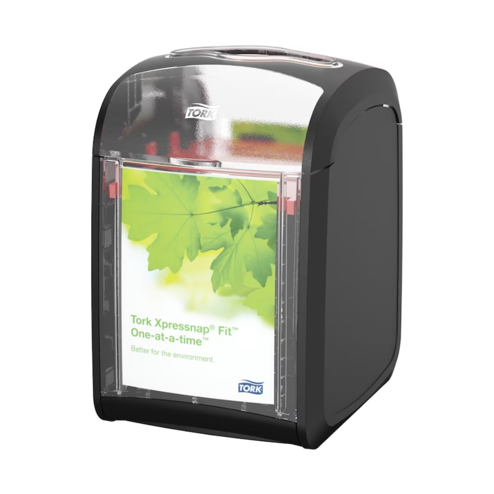A black and transparent table dispenser for napkins by Tork, brand Essity Professional Hygiene Germany GmbH, features a green leaf design with the message "Better for the environment." The top has an opening for gentle and sustainable napkin usage, allowing napkins to be dispensed efficiently. The product is labeled "Tork Xpressnap Fit® 272900" and is available in a box with 4 packs.