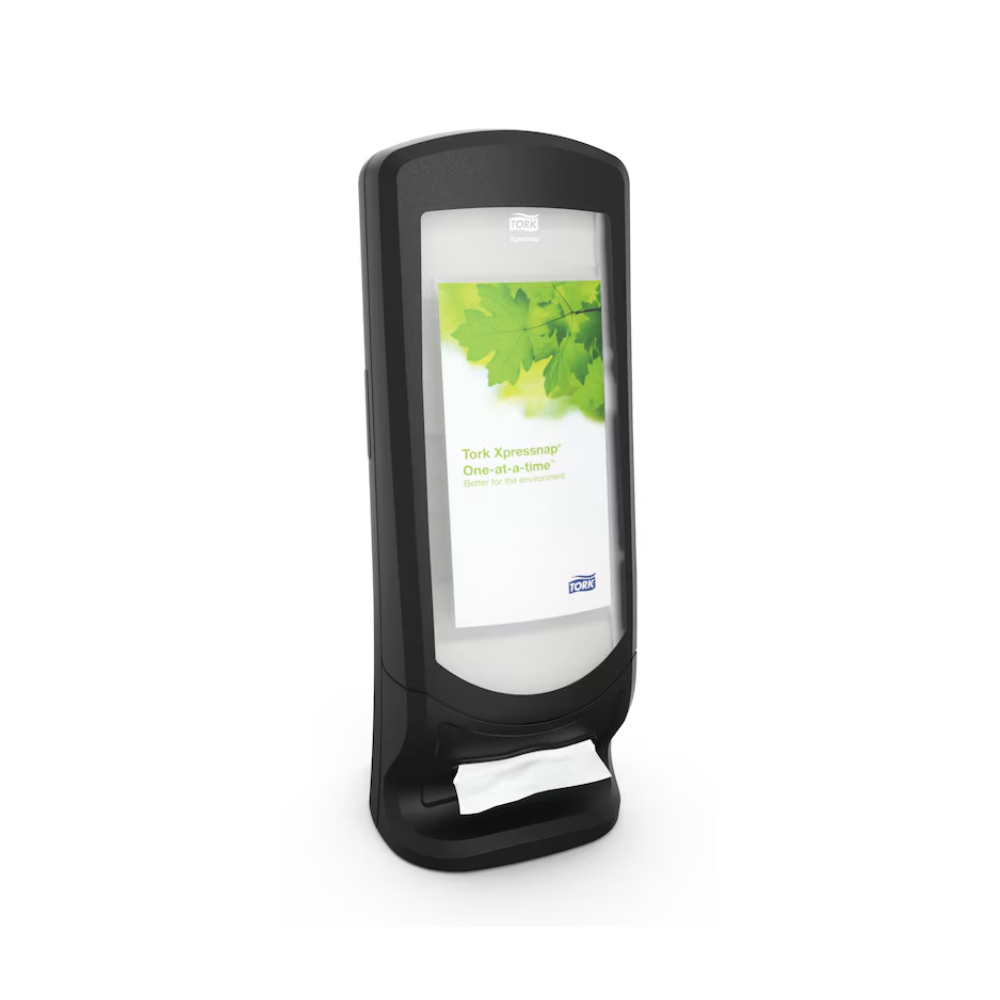 A Tork Xpressnap® 272211 Stand and Wall Dispenser N4 in Black, manufactured by TORK - Essity Professional Hygiene Germany GmbH, is presented vertically and has a label with green leaves on the front. The dispenser features a partially exposed napkin at the bottom for improved hygiene.