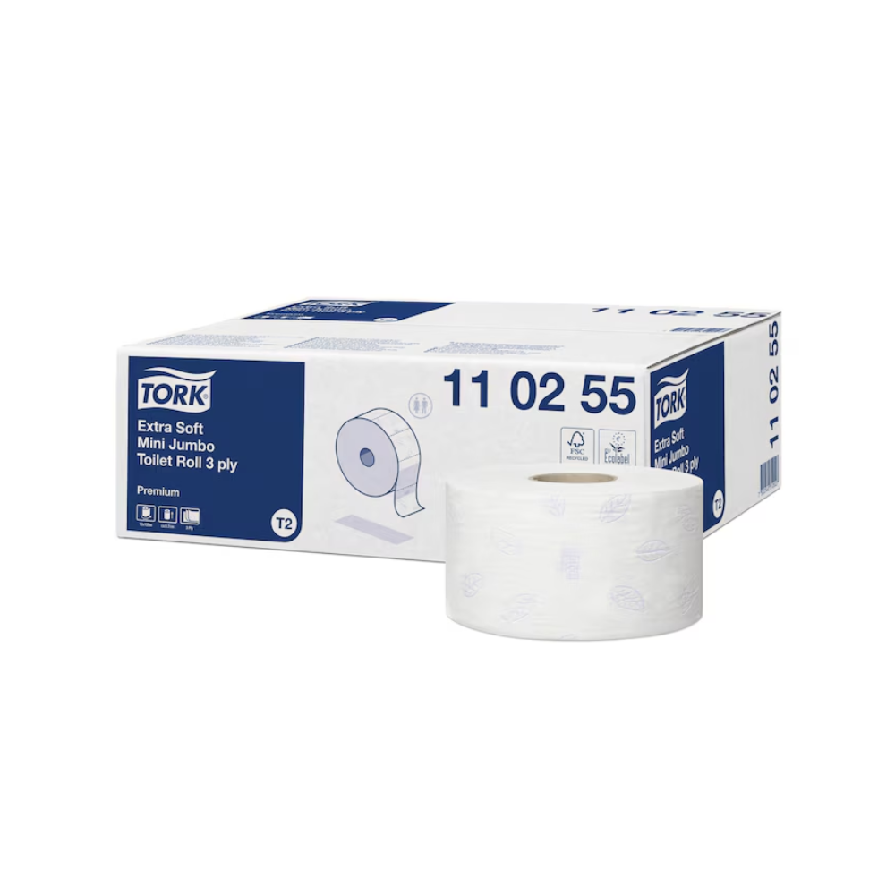 The image shows a pack of Tork 110255 extra soft Mini Jumbo Toilet Paper Premium T2 3-ply from TORK – Essity Professional Hygiene Germany GmbH. Next to it, a single roll is displayed for product demonstration. The packaging is predominantly in the colors white and blue and features printed product details that highlight this extra soft toilet paper.