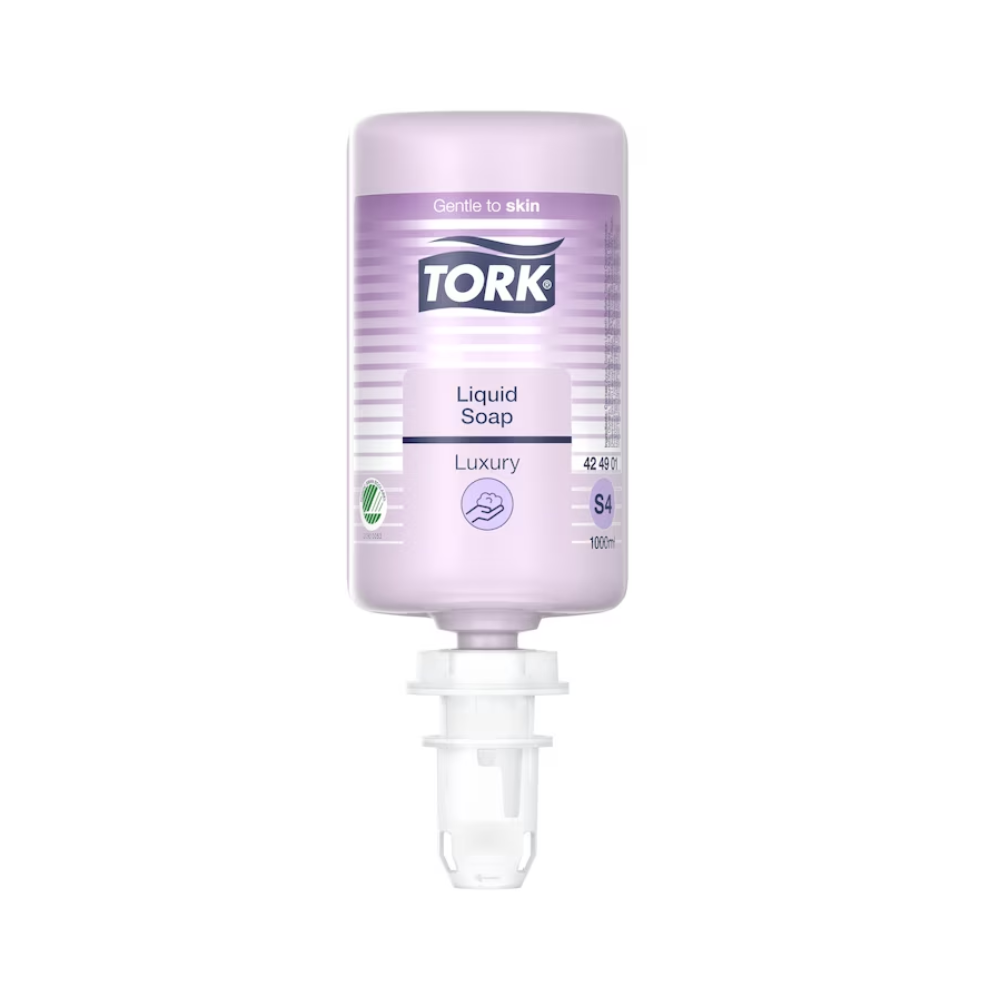 A clear bottle of Tork luxurious liquid soap from Essity Professional Hygiene Germany GmbH, labeled as "Luxury" and "Gentle to the skin", enriched with magnolia extract. The soap is violet and belongs to the S4 system, has a dispensing nozzle at the bottom and offers a volume of 1000 ml.