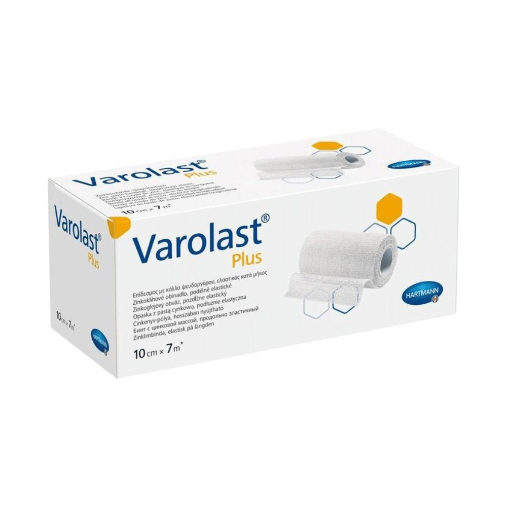 The image shows a package of Hartmann Varolast® Plus zinc paste bandage, containing a zinc paste bandage measuring 10 cm x 7 m. The packaging includes product images, hexagonal graphics, the Paul Hartmann AG logo, and multilingual descriptions. It is designed for conditions such as edema and phlebitis.