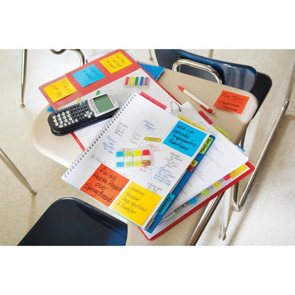 On a student's desk are notebooks, papers, a calculator, and colorful pens organized with the Post-it® Z-Notes Dispenser PRO (black) and Super Sticky Z-Notes (yellow), 76x76mm, from 3M Deutschland GmbH for handwritten math reminders.