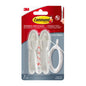A pack of Command™ Cable Holders, 17304-FR from 3M Deutschland GmbH, contains two white cable holders, adhesive strips, and a white cable in a clear plastic packaging - perfect for minimizing cable clutter and improving cable organization.
