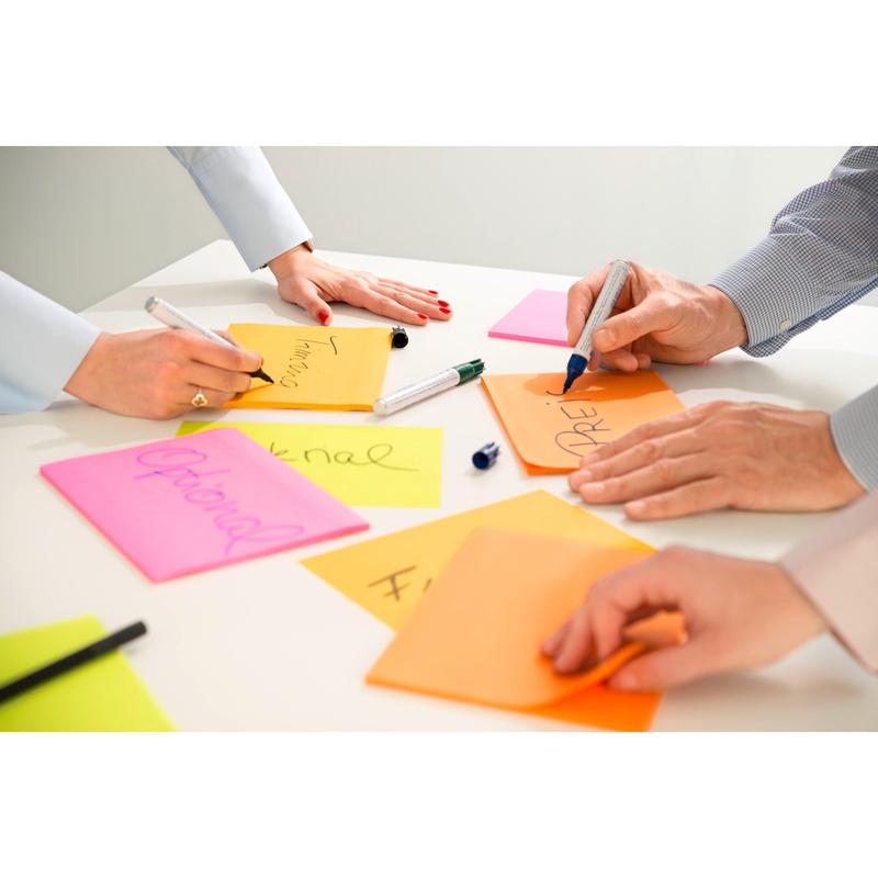 Three people write on 3M Post-it® Super Sticky Meeting Notes in various neon colors (203 x 152 mm, 45 sheets/block, 4 blocks/pack), 100% PEFC certified. Only hands and arms are visible on the bright sticky notes as words are written.