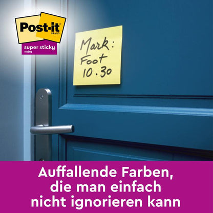 A Post-it® Super Sticky Note in Yellow (76 mm x 127 mm) from 3M Deutschland GmbH is placed over a blue door handle and shows handwriting and a German text. The image also shows colorful sticky notes and highlights the Post-it branding.