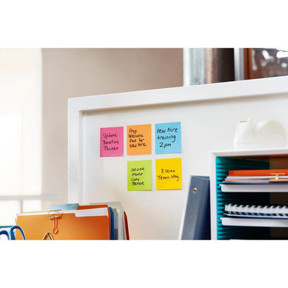 A 3M Post-it® Z-Notes Cat Dispenser in White holds pink Super Sticky Z-Notes (76x76mm, 90 sheets) next to an organizer with folders, a tape dispenser, and stacks of paper.