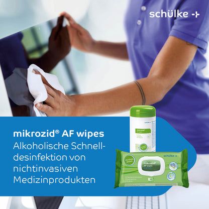 A person with blue gloves uses Schülke Mikrozid AF Wipes Premium Disinfectant Wipes - 50 wipes | pack (50 wipes) to disinfect a surface. The image highlights Schülke Mikrozid AF Wipes premium disinfectant wipes - 50 wipes | pack (50 wipes) from Schülke & Mayr GmbH, emphasizing their role in rapid disinfection of non-invasive medical devices. The product packaging is also visible.